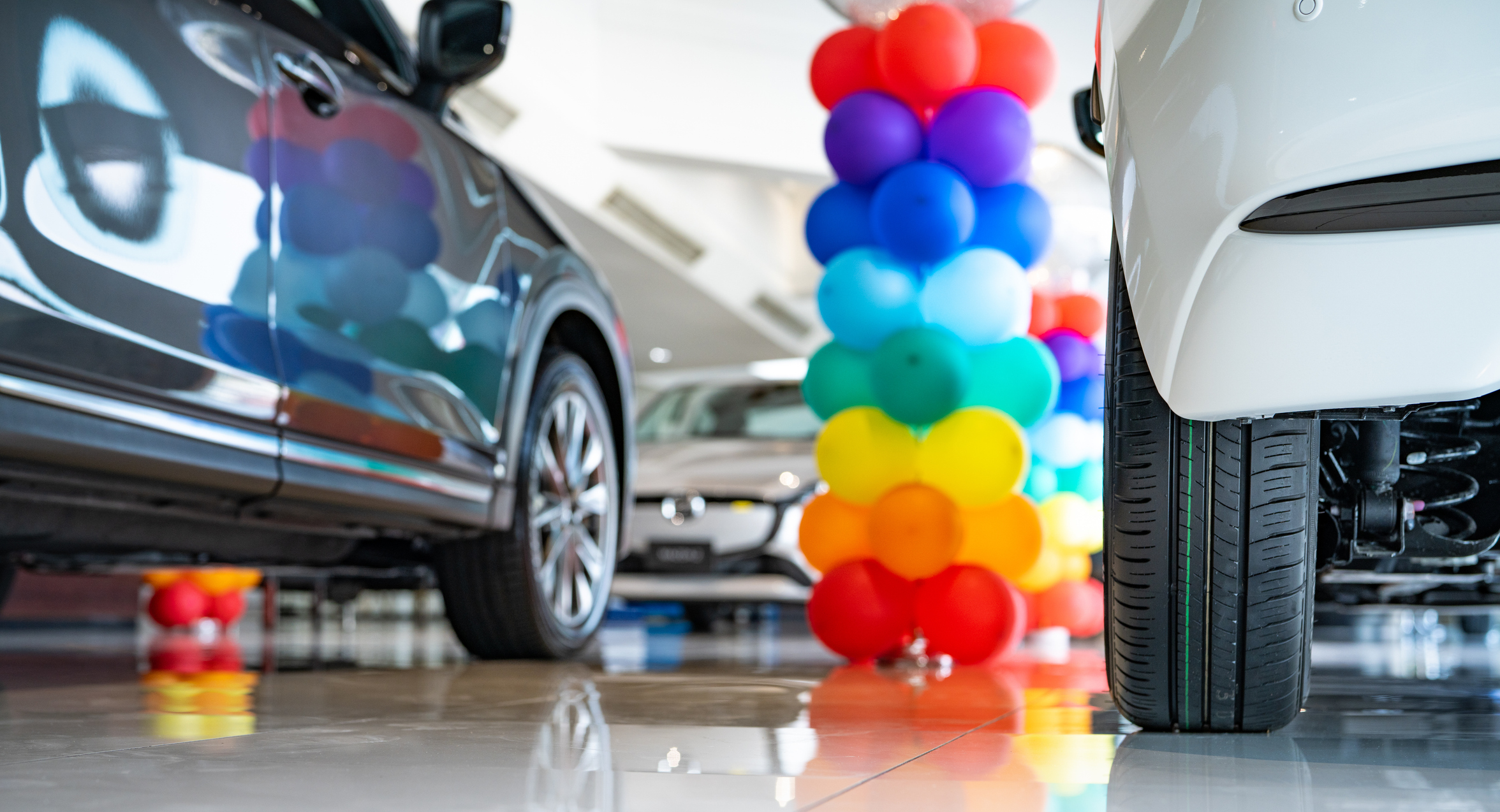 Car parked in luxury showroom. Car dealership office. Car showroom business. New car parked in modern showroom. Auto for sale and rent business. Automobile leasing and insurance. Electric automobile.